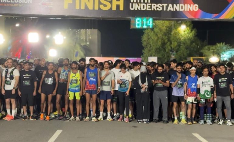 Runners gathered at the start line of Lahore’s first night run for autism awareness under Run for Inclusion event