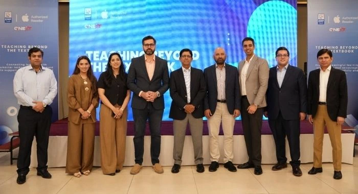DWP Technologies and GNEXT representatives at the Teaching Beyond the Textbook event in Lahore, promoting digital learning, Apple technology and modern education solutions in Pakistan.